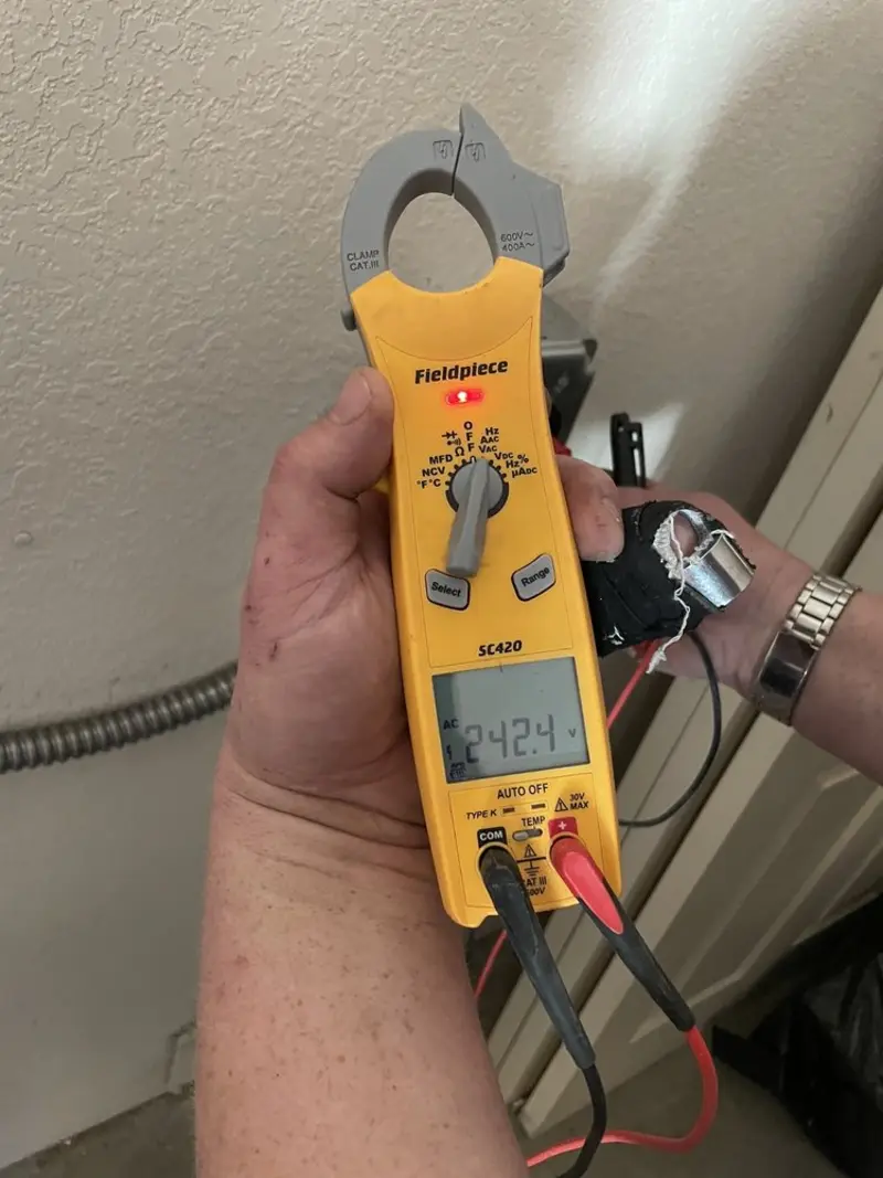 Voltage testing with clamp meter during Ceiling Fan Installation in Glasgow
